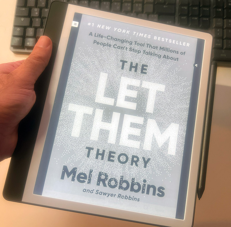 Holding Kindle Scribe in one hand